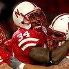 LINCOLN, NE - SEPTEMBER 15:  Cody Glenn #34 of the Nebraska Cornhuskers is congratulated by David Harvey #80 and Matt Slauson #70 after scoring a touchdown against the USC Trojans on September 15, 2007 at Memorial Stadium in Lincoln, Nebraska.  (Photo by 