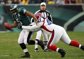 PHILADELPHIA - DECEMBER 30:  Donovan McNabb #5 of the Philadelphia Eagles is sacked by John McCargo #97 of the Buffalo Bills on December 30, 2007 at Lincoln Financial Field in Philadelphia, Pennsylvania.  (Photo by Jim McIsaac/Getty Images)