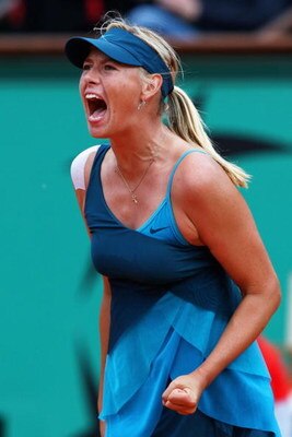 PARIS - MAY 31:  Maria Sharapova of Russia celebrates a point during the Women's Singles Fourth Round match against Na Li of China on day eight of the French Open at Roland Garros on May 31, 2009 in Paris, France.  (Photo by Clive Brunskill/Getty Images)
