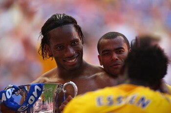 LONDON, ENGLAND - MAY 30:  Michael Essien of Chelsea photographs Didier Drogba and Ashley Cole following victory during the FA Cup sponsored by E.ON Final match between Chelsea and Everton at Wembley Stadium on May 30, 2009 in London, England.  (Photo by 