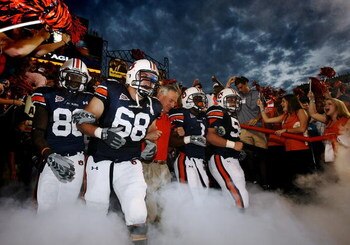 AUBURN, AL - SEPTEMBER 20: Offensive lineman Jason Bosley #68 of the Auburn Tigers leads head coach Tommy Tuberville and the rest of his team out of the tunnel before taking on the LSU Tigers missed a field goal at Jordan-Hare Stadium on September 20, 200