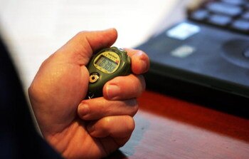NEW YORK - JUNE 7:  Roy Krasik, Senior Director of Major League Baseball Operations, holds a stop watch during the Major League Baseball draft on June 7, 2005 at the Major League Baseball offices in New York City. The draft was conducted via conference ca
