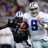 DETROIT - DECEMBER 09:  Quarterback Tony Romo #9 of the Dallas Cowboys makes a break chased by Ernie Sims #50 of the Detroit Lions on December 9, 2007 at Ford Field in Detroit, Michigan. The Cowboys won the match 28-27.  (Photo by Chris McGrath/Getty Imag