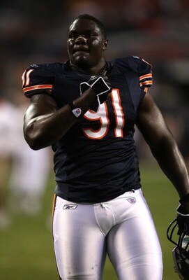 CHICAGO - SEPTEMBER 23:  Tommie Harris #91 of the Chicago Bears looks on against the Dallas Cowboys at Soldier Field on September 23, 2007 in Chicago, Illinois.  (Photo by Jonathan Daniel/Getty Images)