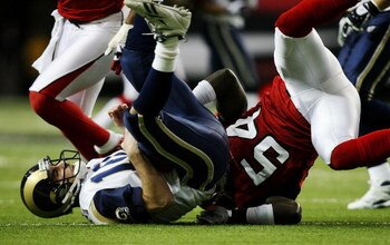 ATLANTA - DECEMBER 28:  Quarterback Marc Bulger #10 of the St. Louis Rams is sacked by linebacker Stephen Nicholas #54 of the Atlanta Falcons at Georgia Dome on December 28, 2008 in Atlanta, Georgia.  (Photo by Doug Benc/Getty Images)