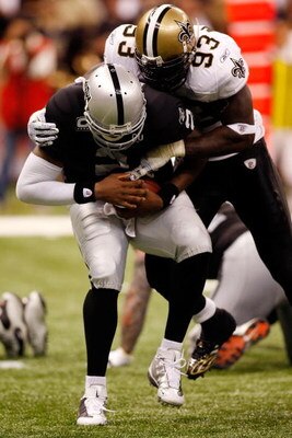 NEW ORLEANS - OCTOBER 12:  Bobby McCray #93 of the New Orleans Saints sacks JaMarcus Russell #2 of the Oakland Raiders on October 12, 2008 at the Superdome in New Orleans, Louisiana.  The Saints defeated the Raiders 34-3.   (Photo by Chris Graythen/Getty 