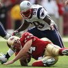 SAN FRANCISCO - OCTOBER 05: Gary Guyton #59 of the New England Patriots tackles quarterback J.T. O'Sullivan #14 of the San Francisco 49ers during an NFL game on October 5, 2008 at Candlestick Park in San Francisco, California.  (Photo by Jed Jacobsohn/Get
