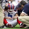 GLENDALE, AZ - OCTOBER 05: Starting Quarterback Trent Edwards #5 of the Buffalo Bills suffers a concussion after getting hit by Strong Safety Adrian Wilson #24 of the Arizona Cardinals during the first half of their NFL Game on October 5, 2008 at Stadium 