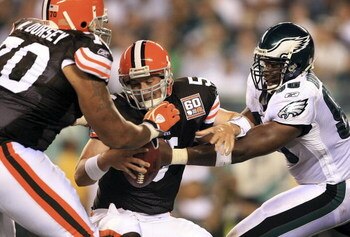 PHILADELPHIA - AUGUST 10:  Quarterback Ken Dorsey #5 of the Cleveland Browns is sacked by Darren Howard #90 of the Philadelphia Eagles during the first half of the pre-season game on August 10, 2006 at Lincoln Financial Field in Philadelphia, Pennsylvania