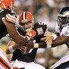 PHILADELPHIA - AUGUST 10:  Quarterback Ken Dorsey #5 of the Cleveland Browns is sacked by Darren Howard #90 of the Philadelphia Eagles during the first half of the pre-season game on August 10, 2006 at Lincoln Financial Field in Philadelphia, Pennsylvania