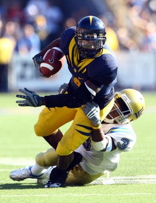 BERKELEY, CA - OCTOBER 25:  Runningback Jahvid Best #4 of the Cal Golden Bears is brought down by Rahim Moore #3 of the UCLA Bruins during the fourth quarter at Memorial Stadium on October 25, 2008 in Berkeley, California. Cal defeated UCLA 41-20. (Photo 