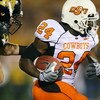 COLUMBIA, MO - OCTOBER 11:  Kendall Hunter #24 of the Oklahoma State Cowboys drags a defender of the Missouri Tigers for yardage on October 11, 2008 at Memorial Stadium in Columbia, Missouri.  (Photo by G. Newman Lowrance/Getty Images)