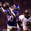 KANSAS CITY, MO - NOVEMBER 24:  Dezmon Briscoe #80 of the Kansas Jayhawks makes a catch as Justin Garrett #8 of the Missouri Tigers defends during the game at Arrowhead Stadium November 24, 2007 in Kansas City, Missouri.  (Photo by Jamie Squire/Getty Imag