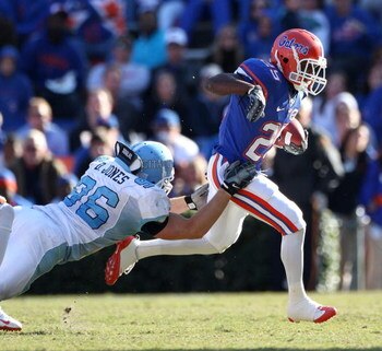GAINESVILLE, FL - NOVEMBER 22:  Brandon James #25 of the Florida Gators breaks a tackle during the game against the Citadel Bulldogs at Ben Hill Griffin Stadium on November 22, 2008 in Gainesville, Florida.  (Photo by Sam Greenwood/Getty Images)