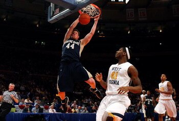 NEW YORK - MARCH 11:  Luke Harangody #44 of the Notre Dame Fighting Irish dunks the ball against the West Virginia Mountaineers during the second round of the Big East Tournament at Madison Square Garden on March 11, 2009 in New York City.  (Photo by Jim 