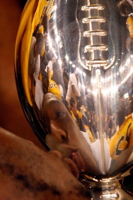 NEW ORLEANS - DECEMBER 21: Ronnie Thornton #56 of the Southern Mississippi Golden Eagles celebrates by kissing the trophy after defeating the Troy Trojans 30-27 in overtime to win the R+L Carriers New Orleans Bowl on December 21, 2008 at the Superdome in 