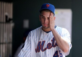 NEW YORK - APRIL 26:  Oliver Perez #46 of the New York Mets reacts in the dugout after he was taken out of their game against the Washington Nationals in the fifth inning on April 26, 2009 at Citi Field in the Flushing neighborhood of the Queens borough o