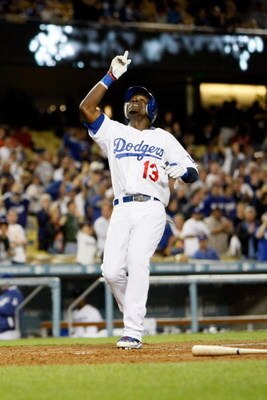 LOS ANGELES, CA - JUNE 09:  Orlando Hudson #13 of the Los Angeles Dodgers celebrates a solo homerun in the fifth inning against the San Diego Padres at Dodger Stadium on June 9, 2009 in Los Angeles, California. The Dodgers defeated the Padres 6-4.  (Photo