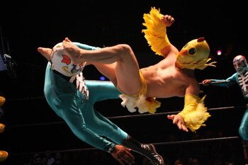LOS ANGELES, CA - MAY 05:  Lil Chicken and one of Los Cavaleras luchadores, traditional Mexican wrestlers, perform at the Lucha Vavoom Cinco de Mayan! show at the Mayan Theater on Cinco de Mayo, May 5, 2009 in Los Angeles, California. Lucha Vavoom combine