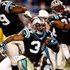 CHARLOTTE, NC - JANUARY 10:  DeAngelo Williams #34 of the Carolina Panthers runs with the ball against  the Arizona Cardinals during the NFC Divisional Playoff Game on January 10, 2009 at Bank of America Stadium in Charlotte, North Carolina. The Arizona C