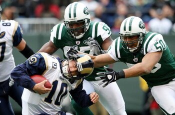 EAST RUTHERFORD, NJ - NOVEMBER 09: Calvin Pace #97 and Eric Barton #50 of the New York Jets sack Marc Bulger #10 of the St. Louis Rams at Giants Stadium on November 9, 2008 in East Rutherford, New Jersey.  (Photo by Nick Laham/Getty Images)