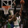BOSTON - MAY 04:  Dwight Howard #12 of the Orlando Magic fouls Rajon Rondo #9 of the Boston Celtics in Game One of the Eastern Conference Semifinals during the 2009 NBA Playoffs at TD Banknorth Garden on May 4, 2009 in Boston, Massachusetts. The Magic def