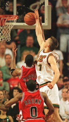 14 Jun 1996: Detlef Schrempf of the Seattle Supersonics blocks a shot by Scottie Pippen of the Chicago Bulls with Randy Brown #0 watching from the floor as the Sonics win game five of the NBA Finals over the Bulls by 89-78 at Key Arena in Seattle, Washing