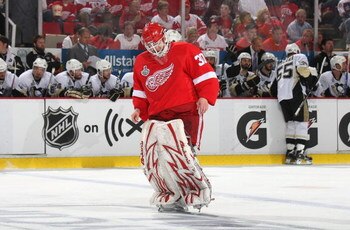 DETROIT - JUNE 12:  Goaltender Chris Osgood #30 of the Detroit Red Wings skates down the ice against the Pittsburgh Penguins during Game Seven of the 2009 NHL Stanley Cup Finals at Joe Louis Arena on June 12, 2009 in Detroit, Michigan.  (Photo by Bruce Be