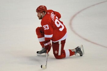 DETROIT - JUNE 12:  Johan Franzen #93 of the Detroit Red Wings reacts after a 2-1 loss to the Pittsburgh Penguins during Game Seven of the 2009 NHL Stanley Cup Finals at Joe Louis Arena on June 12, 2009 in Detroit, Michigan.  (Photo by Harry How/Getty Ima