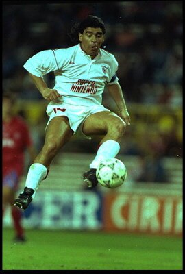 28 SEP 1992:  DIEGO MARADONA OF SEVILLE LEAPS UP TO CONTROL THE BALL DURING THE SEVILLE V BAYERN MUNICH MATCH PLAYED IN THE SANCHEZ PIZJUAN STADIUM IN SEVILLE.