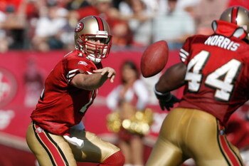 SAN FRANCISCO - OCTOBER 28:  Quarterback Alex Smith #11 of the San Francisco 49ers flips a pass to fullback Moran Norris #44 of the San Francisco 49ers during a game against the New Orleans Saints at Monster Park October 28, 2007 in San Francisco, Califor
