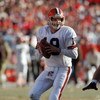 DENVER - JANUARY 17:  Quarterback Bernie Kosar #19 of the Cleveland Browns looks down field for a receiver during the 1987 AFC Championship game against the Denver Broncos at Mile High Stadium on January 17, 1988 in Denver, Colorado.  The Broncos won 38-3