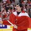 OTTAWA, ON - JANUARY 5:  John Tavares #19 of Team Canada skates with a Canadian flag wrapped around him during post game ceremonies after defeating Team Sweden at the Gold Medal Game of the IIHF World Junior Championships at Scotiabank Place on January 05