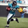 JACKSONVILLE, FL - DECEMBER 14:  A. J. Hawk #50 of the Green Bay Packers attempts to tackle Maurice Jones-Drew #32 of the Jacksonville Jaguars during the game at Jacksonville Municipal stadium on December 14, 2008 in Jacksonville, Florida.  (Photo by Sam 