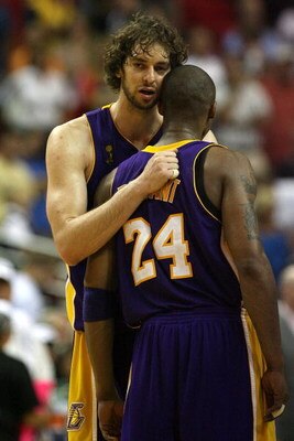 ORLANDO, FL - JUNE 11:  Pau Gasol #16 hugs Kobe Bryant #24 of the Los Angeles Lakers in the final moments of the Lakers' overtime win over the Orlando Magic in Game Four of the 2009 NBA Finals on June 11, 2009 at Amway Arena in Orlando, Florida.  NOTE TO 