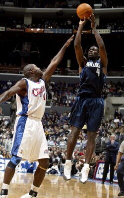 LOS ANGELES - DECEMBER 10:  Michael Finley #4 of the Dallas Mavericks shoots over Glen Rice #41 of the Los Angeles Clippers December 10, 2003 at Staples Center in Los Angeles, California.  NOTE TO USER: User expressly acknowledges and agrees that, by down