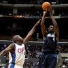 LOS ANGELES - DECEMBER 10:  Michael Finley #4 of the Dallas Mavericks shoots over Glen Rice #41 of the Los Angeles Clippers December 10, 2003 at Staples Center in Los Angeles, California.  NOTE TO USER: User expressly acknowledges and agrees that, by down