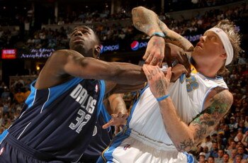 DENVER - MAY 13:  Chris Andersen #11 of the Denver Nuggets and Brandon Bass #32 of the Dallas Mavericks battle for position in Game Five of the Western Conference Semifinals during the 2009 NBA Playoffs at Pepsi Center on May 13, 2009 in Denver, Colorado.