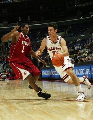 LOS ANGELES, CA - MARCH 10:  Chris Hernandez #11 of the Stanford Cardinal drives against Thomas Kelati #11 of the Washington State Cougars during the 2005 Pacific Life Pac-10 Men's Basketball Tournament Game 4 at Staples Center on March 10, 2005 in Los An