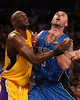 LOS ANGELES, CA - JUNE 04:  Lamar Odom #7 of the Los Angeles Lakers and Marcin Gortat #13 of the Orlando Magic battle for positon in the fourth quarter of Game One of the 2009 NBA Finals at Staples Center on June 4, 2009 in Los Angeles, California. NOTE T