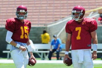 LOS ANGELES, CA - APRIL 25:  Quarterback Aaron Corp #15 and Matt Barkley #7 of the USC Trojans white team talk before the spring game on April 25, 2009 at the Los Angeles Memorial Coliseum in Los Angeles, California.  (Photo by Matt Kincaid/Getty Images)