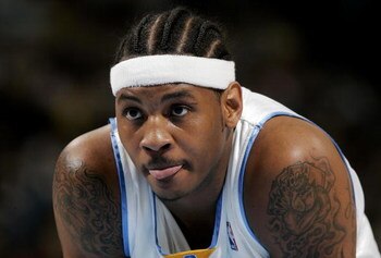 DENVER - APRIL 29:  Carmelo Anthony #15 of the Denver Nuggets awaits play to resume against the Los Angeles Clippers in game four of the Western Conference Quarterfinals during the 2006 NBA Playoffs on April 29, 2006 at the Pepsi Center in Denver, Colorad