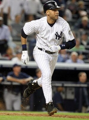 NEW YORK - JUNE 08:  Derek Jeter #2 of the New York Yankees hits a solo home run in the eighth inning against the Tampa Bay Rays on June 8, 2009 at Yankee Stadium in the Bronx borough of New York City.  (Photo by Nick Laham/Getty Images)