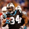 CHARLOTTE, NC - JANUARY 10:  Running back DeAngelo Williams #34 of the Carolina Panthers runs the ball against the Arizona Cardinals during the first quarter of the NFC Divisional Playoff Game on January 10, 2009 at Bank of America Stadium in Charlotte, N