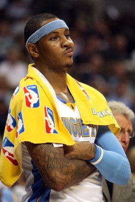 DENVER - MAY 29:  Carmelo Anthony #15 of the Denver Nuggets looks on from the bench in the fourth quarter of Game Six of the Western Conference Finals during the 2009 NBA Playoffs against the Los Angeles Lakers at Pepsi Center on May 29, 2009 in Denver, C