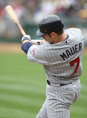 OAKLAND, CA - JUNE 11: Joe Mauer #7 of the Minnesota Twins bats against the Oakland Athletics during a Major League Baseball game on June 11, 2009 at the Oakland Coliseum in Oakland, California. (Photo by Jed Jacobsohn/Getty Images)