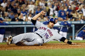 LOS ANGELES, CA - MAY 19:  Carlos Beltran #15 of the New York Mets slides across home plate to score in the third inning against the Los Angeles Dodgers at Dodger Stadium on May 19, 2009 in Los Angeles, California. The Dodgers defeated the Mets 5-3.  (Pho
