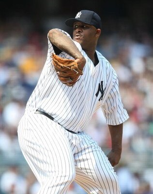NEW YORK - MAY 24:  CC Sabathia #52 of the New York Yankees pitches against the Philadelphia Phillies on May 24, 2009 at Yankee Stadium in the Bronx borough of New York City.  (Photo by Nick Laham/Getty Images)
