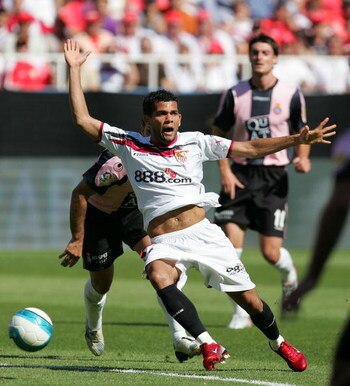SEVILLE, SPAIN - APRIL 29:  Dani Alves of Sevilla beats Ito of Espanol during the Primera Liga match between Sevilla and Espanol at the Sanchez Pizjuan stadium on April 29, 2007 in Seville, Spain.  (Photo by Denis Doyle/Getty Images)