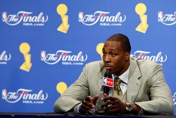 ORLANDO, FL - JUNE 14:  Dwight Howard #12 of the Orlando Magic looks on during the post game news conference after losing to the Los Angeles Lakers 99-86 in Game Five of the 2009 NBA Finals on June 14, 2009 at Amway Arena in Orlando, Florida.  NOTE TO USE